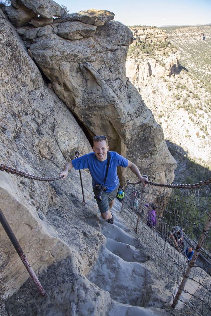 The adventure's grand finale was a climb up the sheer rock cliff face. The footholds you see here are typical of the Pueblo dwellings. They used them daily to come and go from the alcove. But they didn't have chains and safety fences! The key to doing this was avoiding looking down.