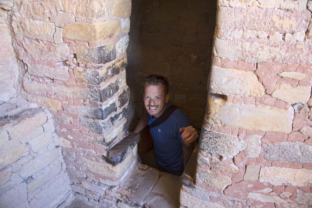 We needed to climb a very narrow flight of sandstone stairs in a dark, tight corridor. Here Billy is happily emerging.