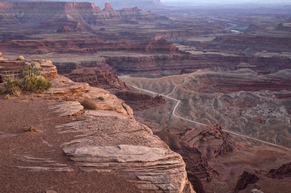 View of the canyons at Dead Horse Point. You can see the 4-wheel driving road in the photo. It looks white.