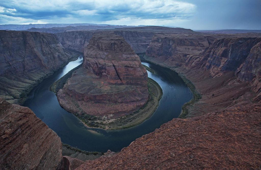 The famous Horseshoe Bend. The Colorado River didn't seem like it was moving. You can see the thunderheads in the distance.