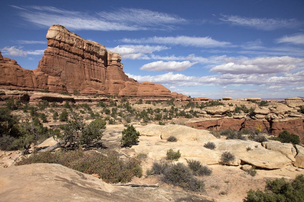 One of hundreds of photos I took of the scenery along the way. The lighter stone is stronger than the darker stone. It protects the darker stone from erosion, which is how the spires and "mushrooms" form.