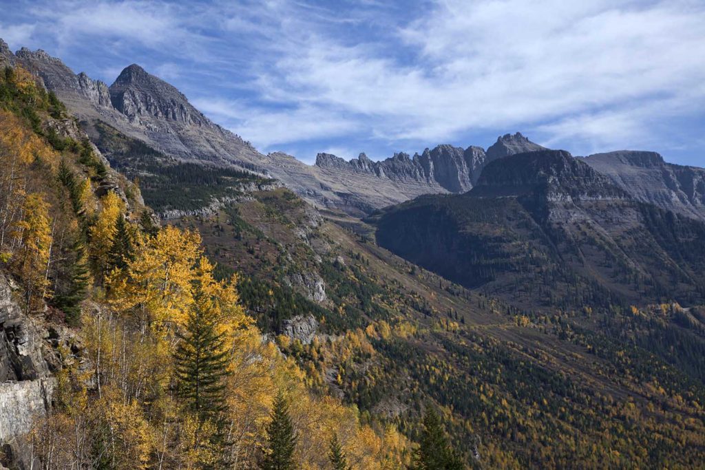 The Going to the Sun Road is that tiny thread that runs across the slopes.