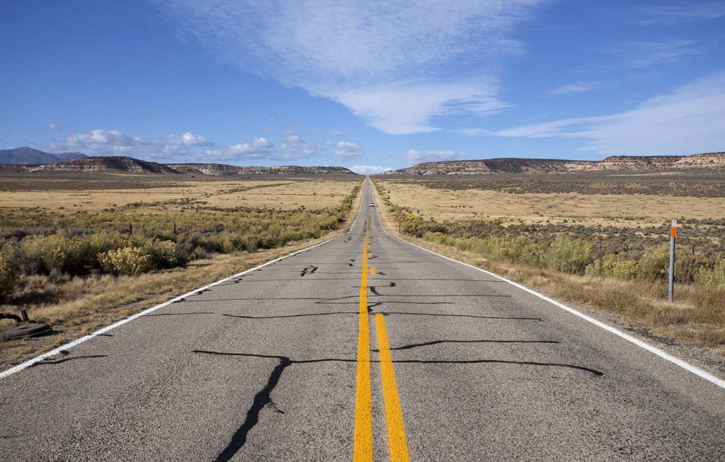 Just one of the endless roads of the Utah plains