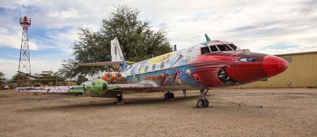 A few planes were on display as pieces of art. This piece is called "Back to Supersonica" and was created with spray paint on a Lockheed Jetstar. Artist is Kenny Scharf.