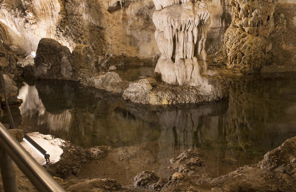 All of the pools in the cavern are the result of water seeping through the ceiling. No water flows in either by spring or stream.